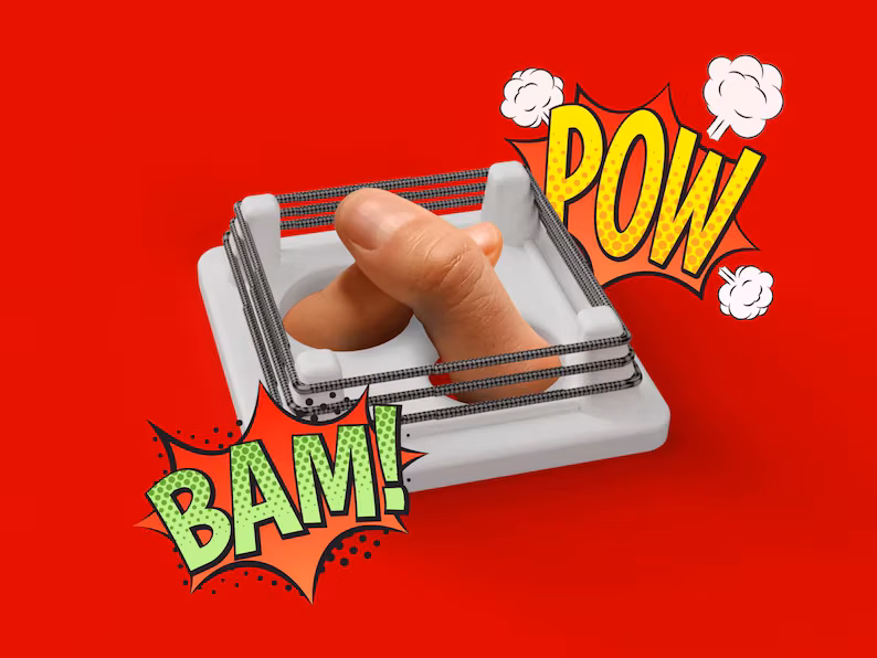 Miniature thumb wrestling ring with comic book graphics